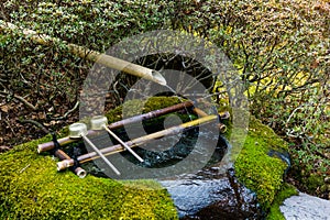 Water purification at entrance of the Japanese temple. Japan ladle in shrine