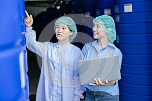 Water quality control officer engineer team inspect water tanks in beverage industry factory for ensure cleanliness standards