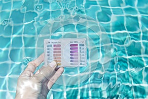 Water quality test kit in clear pool water