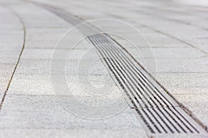 Water during rain runoff flows into photo