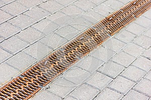 Water during a rain runoff flows into photo