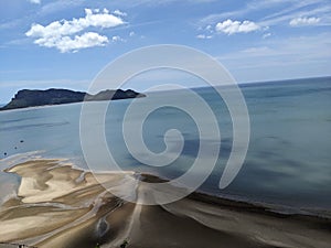 The water receded until you could see the beautiful sand photo