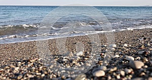 Water recedes from stones and sea beach