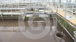 Water recycling. Sewage water treatment plant. Water flow into hole. Static shot