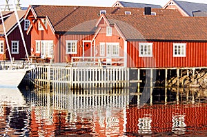 Water with reflecting red houses, Lofoten, Norway