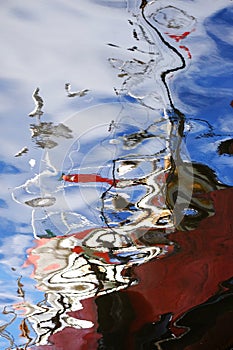 Water reflection of a fishing boat