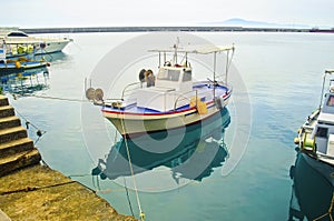Water reflection of a fishing boat Greece