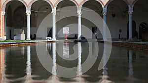 Water Reflection Inside Castello Sforzesco Public Area In Milan Italy