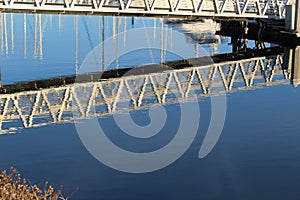 Water reflection under dock gangway