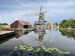 Water reflection of the windmill De Rat