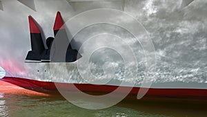 Water reflections on the side of a white painted boat