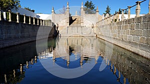 Water reservoir with cascade fountain in The Garden of the Episcopal Palace, Jardim do Paco, Castelo Branco, Portugal photo