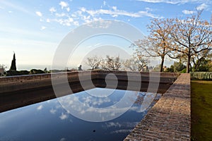 Water Reservoir with Reflection at Carmen de los Martires Park in Granada, Spain