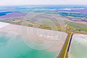 Water reservoirs situated near spring farmland, aerial landscape