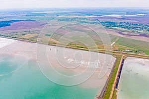 Water reservoirs situated near spring farmland, aerial landscape photo