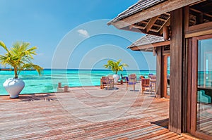 Water restaurant at the background of the blue sky in Maldives island