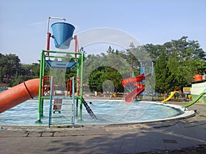 water rides in a swimming pool on a sunny day