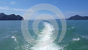 Water ripples forming behind speed boat In Phi Phi Island