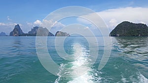 Water ripples forming behind speed boat in Phi Phi Island