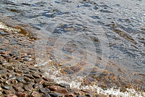 The water of the river Neva washes the stones of the base of Peter-Paul Fortress Fortress in Saint Petersburg, Russia.