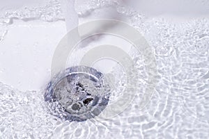 Water running down in the drain