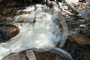 Water rushing down the small river at Waterfall Old Mill or Chachoeira da Usina Velha photo