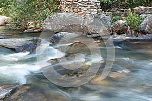 Water rushing down the small river at Waterfall Old Mill or Chachoeira da Usina Velha photo