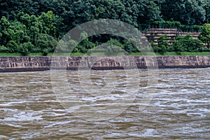 Water rushing downriver after torrential rainfall