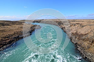 Water rushing through Iceland around a curve