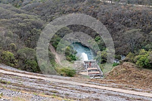Water rushing from a valve at the Las Maderas Dam, Jujuy Province, Argentina photo