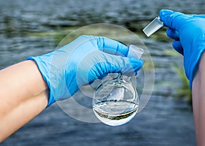 A water sample from the river. Water intake. Water abstraction.