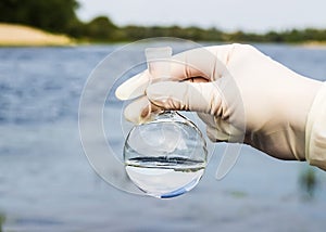 A water sample from the river. Water intake. Water abstraction.