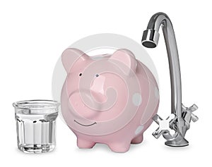 Water scarcity concept. Piggy bank, tap and glass of drink on white background