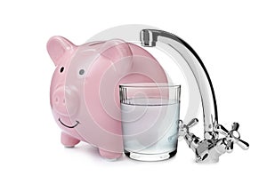 Water scarcity concept. Piggy bank, tap and glass on white background