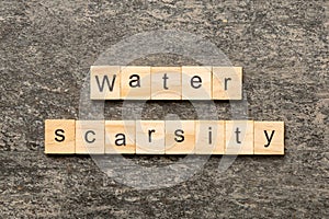 Water scarcity word written on wood block. Water scarcity text on cement table for your desing, concept