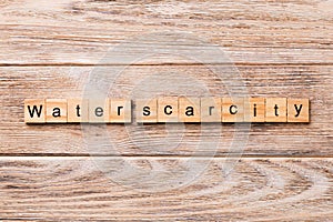 Water scarcity word written on wood block. Water scarcity text on wooden table for your desing, concept