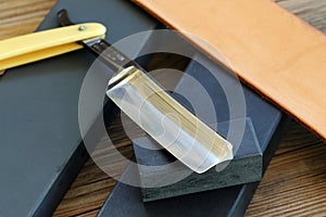 Water sharpening stones, leather strop and cutthroat razor