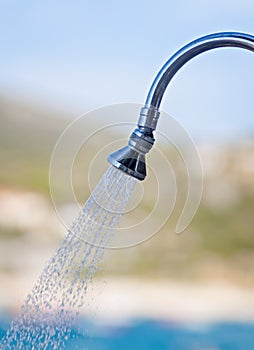 Water shower at beach and sunny day