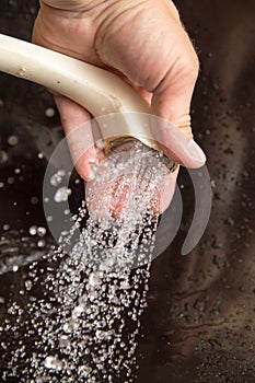 Water from the shower in your hand