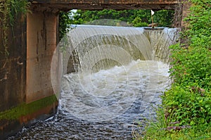 Water from side channel spillway through the tunnel