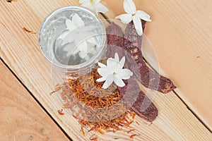 Water in silver bowl with Jasmine Safflower and Acacia concinna, Thailand Songkarn festival