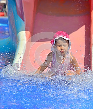 Water slide fun on outdoor pool in summer