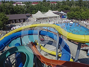 Water slides in aqua park at outdoor swimming pool