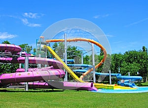 Water slides and pool, aquapark in the green park