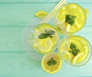 Water soda lemon tube citrus cool refreshment , freshness homemade health mint summer on a blue wooden background