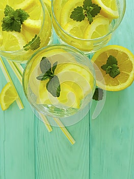 Water soda lemon tube citrus detox refreshment , freshness homemade health mint summer on a blue wooden background