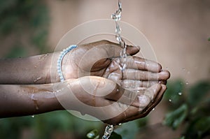 Water Spilling Into Black African Children`s Hands Drought / Wa