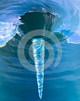 Water spiralling down a drain