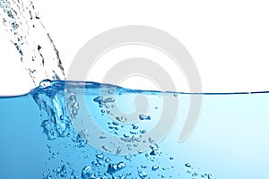 water splash with air bubbles. Fresh and clean surface aqua flowing in wave and clean water on white background isolated. close-up