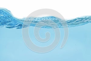 Water splash and air bubbles isolated over white background. Blue water wave hydrate abstract art and splash craft are drop,